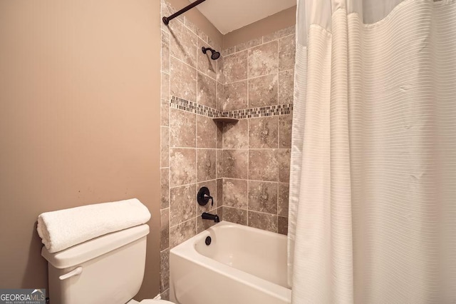 bathroom featuring shower / bath combination with curtain and toilet