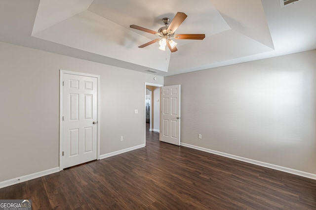 363 Chadwick Commons, Stockbridge, GA 30281 - unfurnished bedroom with a raised ceiling, dark wood-style floors, baseboards, and ceiling fan
