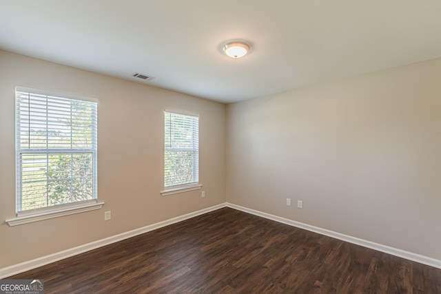 363 Chadwick Commons, Stockbridge, GA 30281 - unfurnished room with dark wood finished floors, healthy amount of natural light, and baseboards