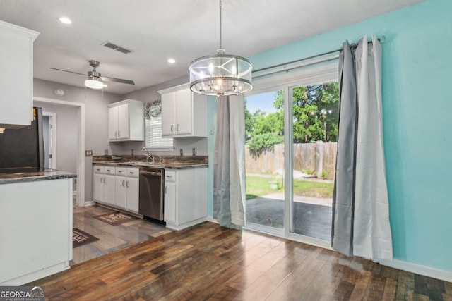 114 Pineneedle Ct, Kingsland, GA 31548 - kitchen featuring appliances with stainless steel finishes, a chandelier, white cabinets, healthy amount of natural light, and recessed lighting