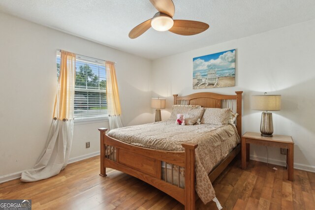 114 Pineneedle Ct, Kingsland, GA 31548 - bedroom featuring baseboards, wood finished floors, and ceiling fan