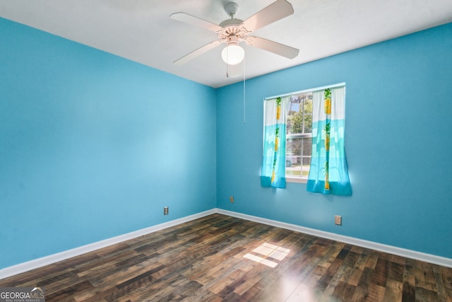 114 Pineneedle Ct, Kingsland, GA 31548 - spare room featuring baseboards, a ceiling fan, and dark wood-type flooring