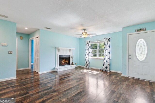 114 Pineneedle Ct, Kingsland, GA 31548 - unfurnished living room featuring wood finished floors, ceiling fan, a lit fireplace, baseboards, and recessed lighting