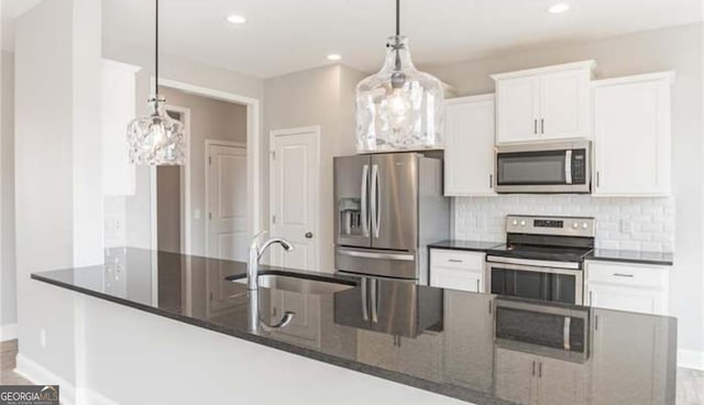118 Grimsby Rd, Savannah, GA 31407 - kitchen featuring appliances with stainless steel finishes, a sink, decorative backsplash, white cabinets, and recessed lighting