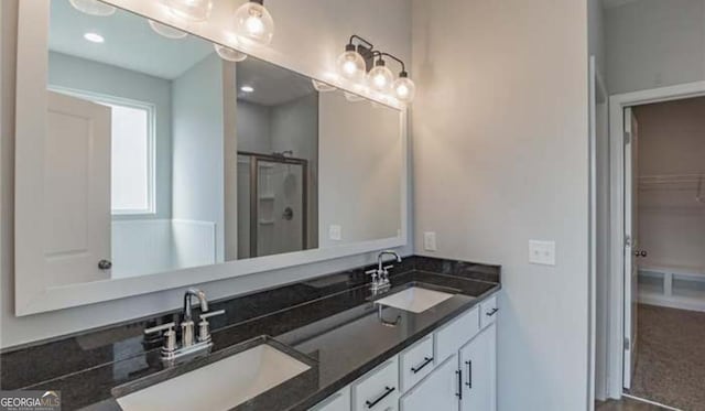 118 Grimsby Rd, Savannah, GA 31407 - bathroom featuring a shower stall, double vanity, and a walk in closet