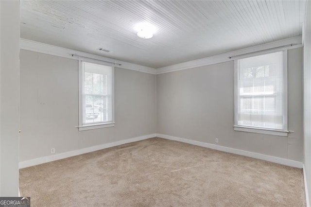 144 6th St, Monroe, GA 30655 - carpeted spare room with baseboards and ornamental molding