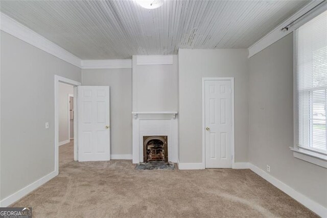 144 6th St, Monroe, GA 30655 - unfurnished living room featuring carpet flooring, a fireplace, and baseboards