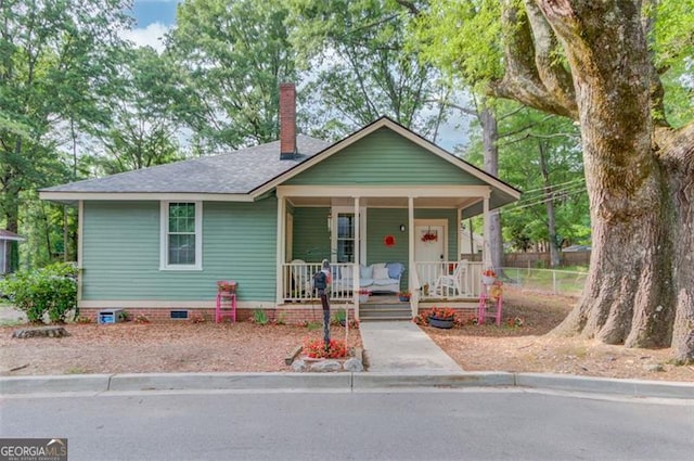 144 6th St, Monroe, GA 30655 - bungalow-style home with covered porch, crawl space, a chimney, a shingled roof, and fence
