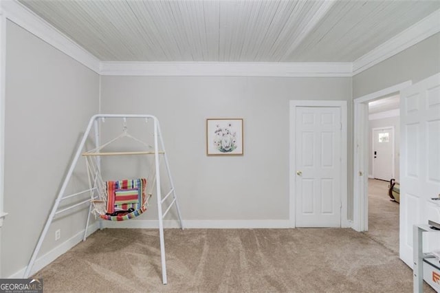 144 6th St, Monroe, GA 30655 - recreation room with crown molding, carpet flooring, and baseboards