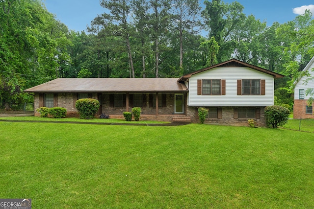 tri-level home featuring brick siding