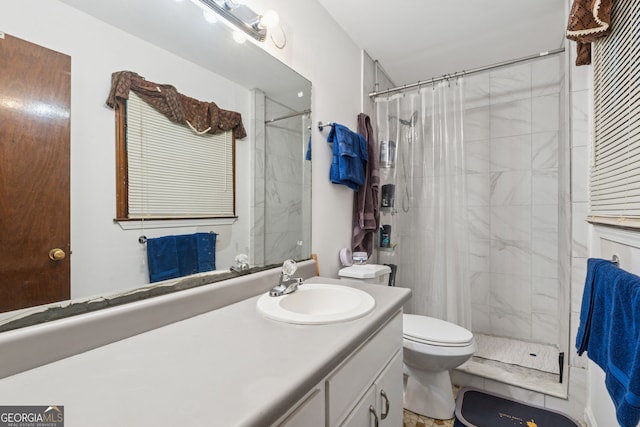 full bath with a shower stall, toilet, and vanity