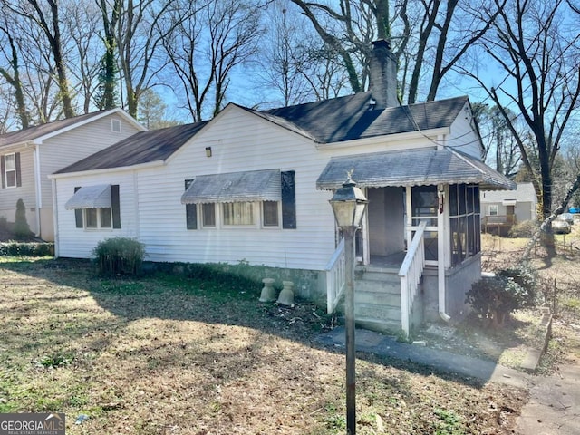 1386 Bluefield Dr SW, Atlanta, GA 30310 - view of front of home featuring a chimney and a shingled roof