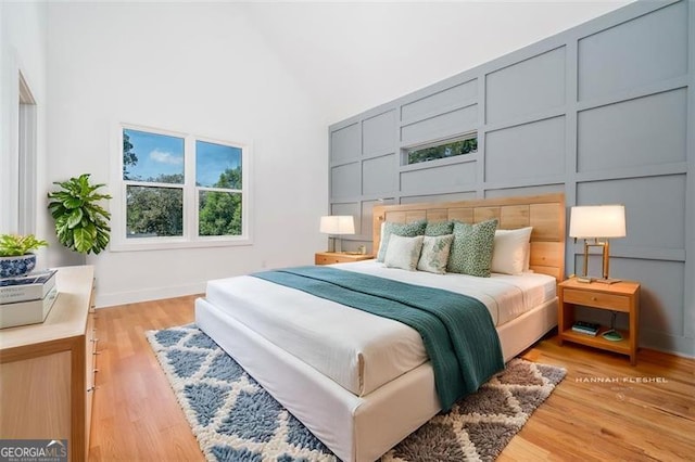 140 Racine St, Atlanta, GA 30314 - bedroom with high vaulted ceiling and light wood-style floors