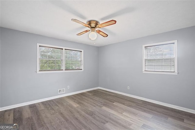 6997 Vesta Brook Dr, Morrow, GA 30260 - spare room featuring ceiling fan, wood finished floors, and baseboards
