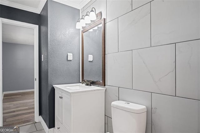 6997 Vesta Brook Dr, Morrow, GA 30260 - bathroom with crown molding, toilet, baseboards, vanity, and a textured wall