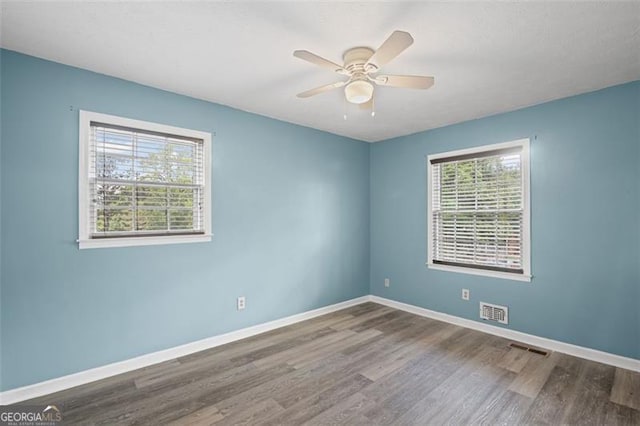 6997 Vesta Brook Dr, Morrow, GA 30260 - spare room featuring wood finished floors, baseboards, and ceiling fan