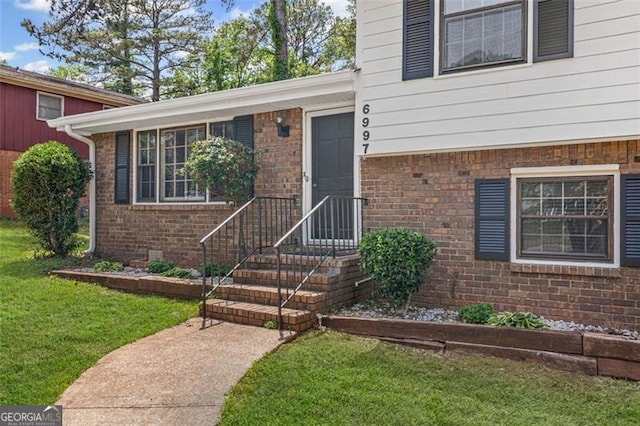 6997 Vesta Brook Dr, Morrow, GA 30260 - property entrance featuring brick siding and a lawn