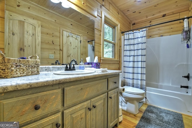 120 Christopher Dr, Ellijay, GA 30540 - bathroom featuring vanity, wood finished floors, shower / bath combo with shower curtain, and wooden walls