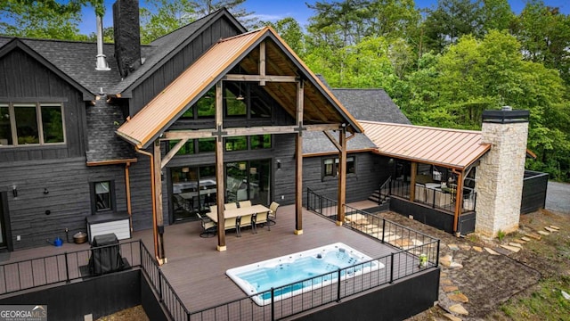 312 Charles Rd, Ellijay, GA 30540 - rear view of property featuring a wooden deck, board and batten siding, a chimney, and a standing seam roof