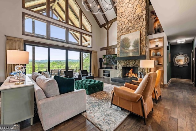 312 Charles Rd, Ellijay, GA 30540 - living area with high vaulted ceiling, a fireplace, dark wood-type flooring, a chandelier, and beam ceiling