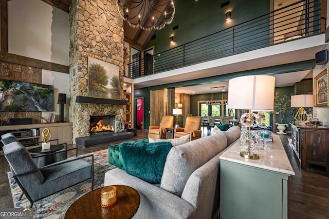 312 Charles Rd, Ellijay, GA 30540 - living area featuring a chandelier, high vaulted ceiling, wood finished floors, a fireplace, and beam ceiling