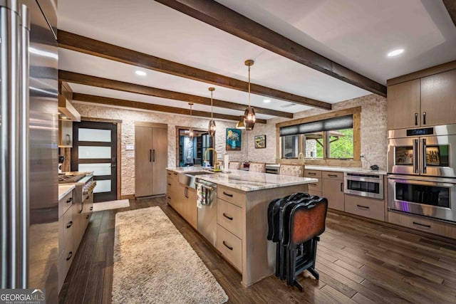 312 Charles Rd, Ellijay, GA 30540 - kitchen featuring appliances with stainless steel finishes, dark wood-style flooring, decorative light fixtures, light stone counters, and recessed lighting