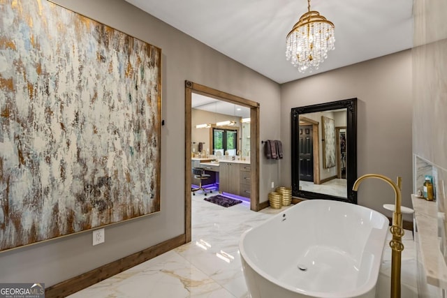 312 Charles Rd, Ellijay, GA 30540 - full bathroom with a chandelier, vanity, a freestanding tub, and marble tiled flooring
