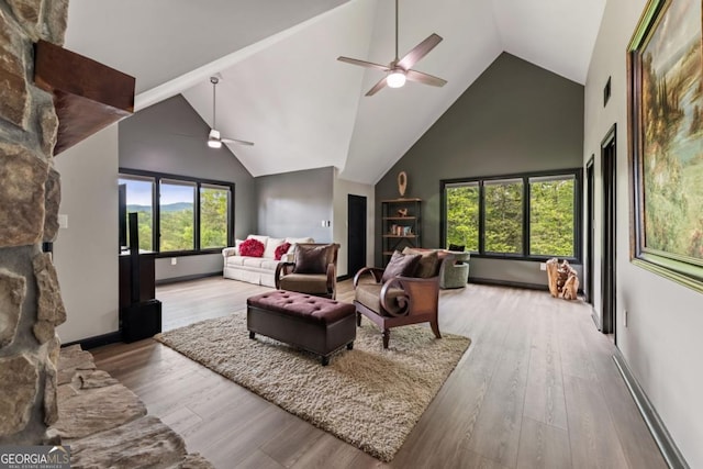 312 Charles Rd, Ellijay, GA 30540 - living room featuring ceiling fan, high vaulted ceiling, wood finished floors, and baseboard heating