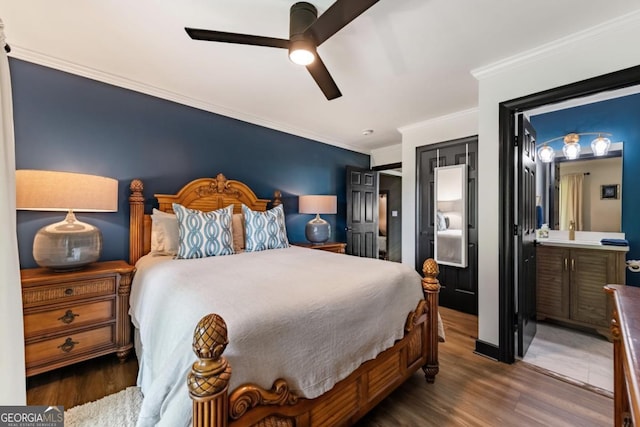 312 Charles Rd, Ellijay, GA 30540 - bedroom with ornamental molding, wood finished floors, ceiling fan, and connected bathroom