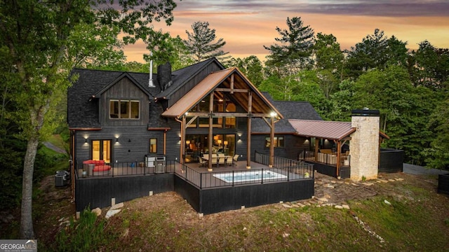 312 Charles Rd, Ellijay, GA 30540 - back of house with a pool, a wooden deck, a balcony, and a chimney