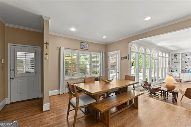 194 Sentinel Pl SE, Marietta, GA 30067 - dining area with light wood-style floors, baseboards, recessed lighting, and crown molding