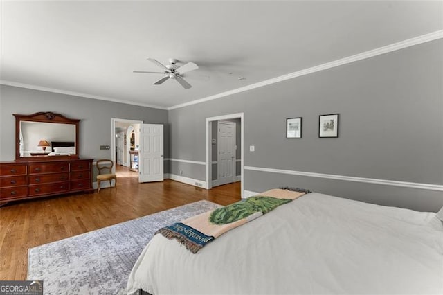 194 Sentinel Pl SE, Marietta, GA 30067 - bedroom with crown molding, wood finished floors, baseboards, and a ceiling fan
