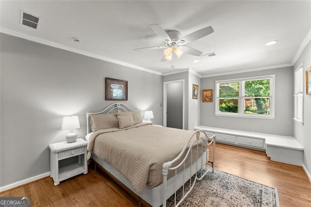 194 Sentinel Pl SE, Marietta, GA 30067 - bedroom featuring wood finished floors, baseboards, a ceiling fan, ornamental molding, and recessed lighting