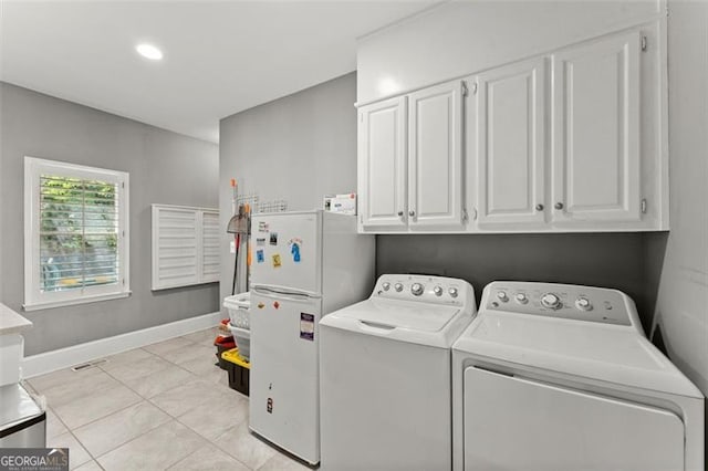 194 Sentinel Pl SE, Marietta, GA 30067 - washroom with separate washer and dryer, cabinet space, light tile patterned floors, and baseboards