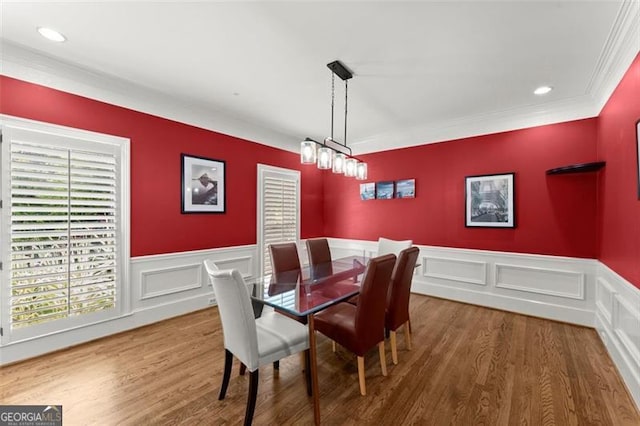194 Sentinel Pl SE, Marietta, GA 30067 - dining space featuring ornamental molding, wood finished floors, a wainscoted wall, and a decorative wall