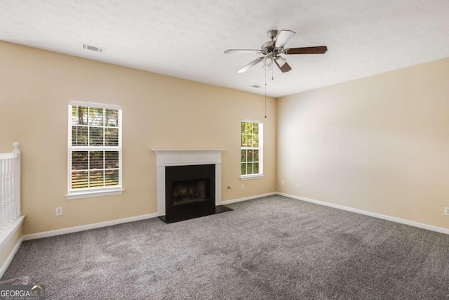 40 Wimberly Way, Covington, GA 30016 - unfurnished living room with ceiling fan, carpet floors, and plenty of natural light