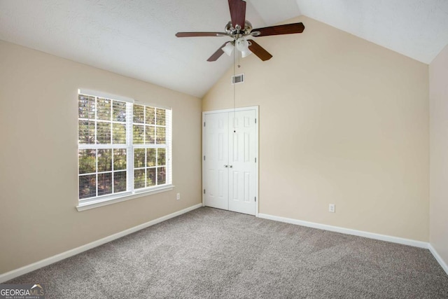40 Wimberly Way, Covington, GA 30016 - unfurnished bedroom featuring carpet flooring, baseboards, high vaulted ceiling, a closet, and a ceiling fan