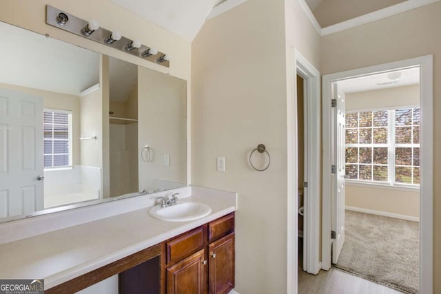 40 Wimberly Way, Covington, GA 30016 - full bathroom featuring vanity, a shower, baseboards, and a bath