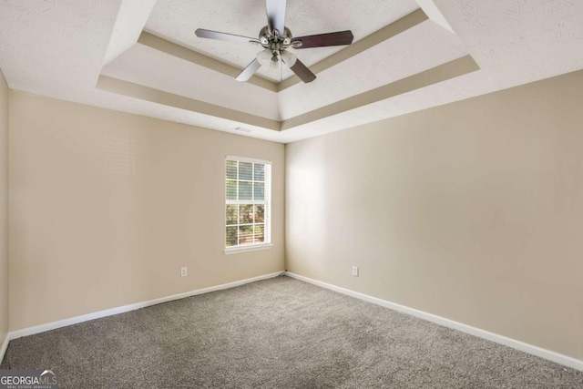 40 Wimberly Way, Covington, GA 30016 - carpeted empty room with a raised ceiling, baseboards, and ceiling fan