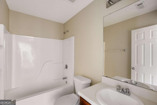 40 Wimberly Way, Covington, GA 30016 - bathroom with vanity, shower / tub combination, and toilet