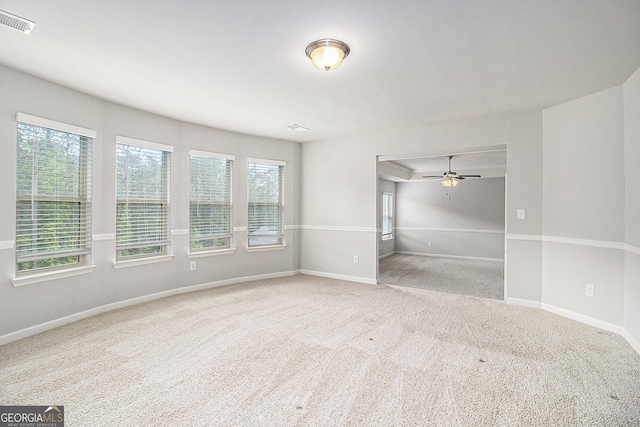 206 Brookview Dr, Newnan, GA 30265 - unfurnished bedroom featuring multiple windows, carpet, and baseboards