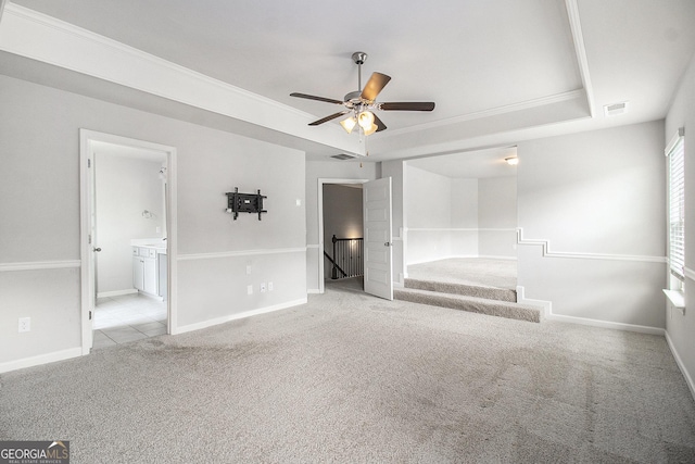 206 Brookview Dr, Newnan, GA 30265 - unfurnished bedroom with a tray ceiling, carpet, ornamental molding, baseboards, and ensuite bath