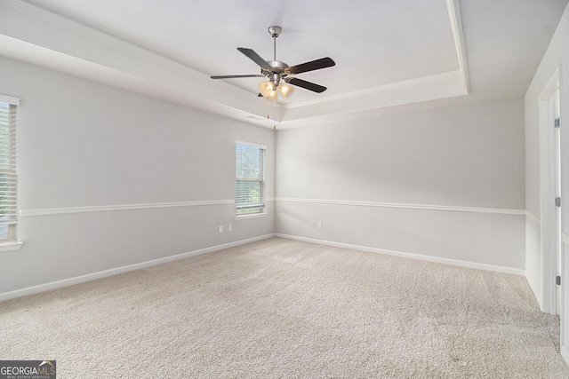 206 Brookview Dr, Newnan, GA 30265 - carpeted spare room featuring a raised ceiling, a ceiling fan, baseboards, and ornamental molding