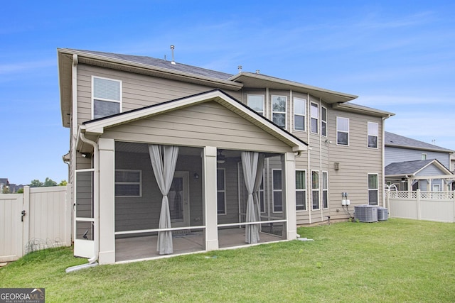 206 Brookview Dr, Newnan, GA 30265 - rear view of property featuring a sunroom and central AC