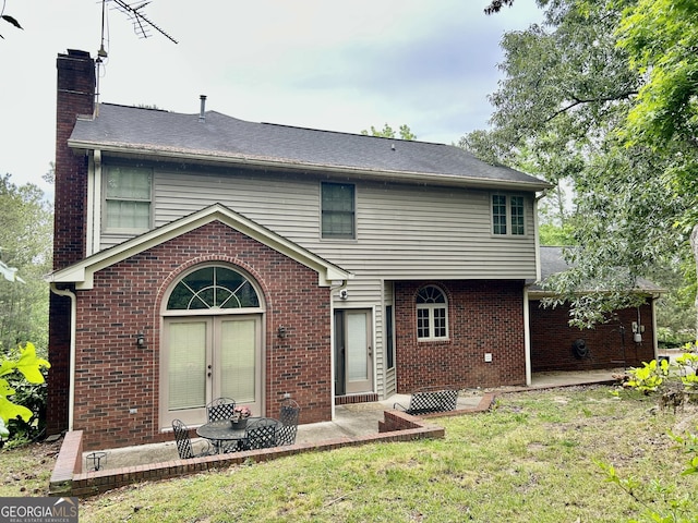 1808 Stoney Crest Dr, Elberton, GA 30635 - rear view of property featuring a chimney, brick siding, a patio area, and a yard