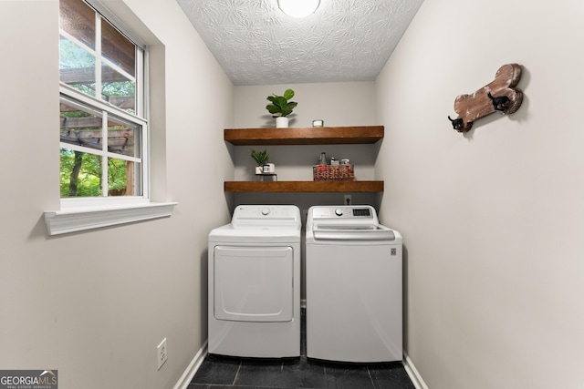 6520 Glen Pond Trce, Cumming, GA 30028 - clothes washing area with washing machine and dryer, baseboards, and dark tile patterned flooring