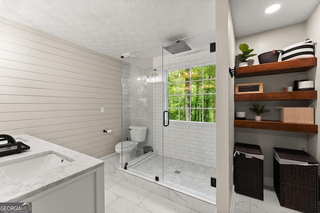 6520 Glen Pond Trce, Cumming, GA 30028 - full bath with marble finish flooring, a stall shower, toilet, a textured ceiling, and vanity