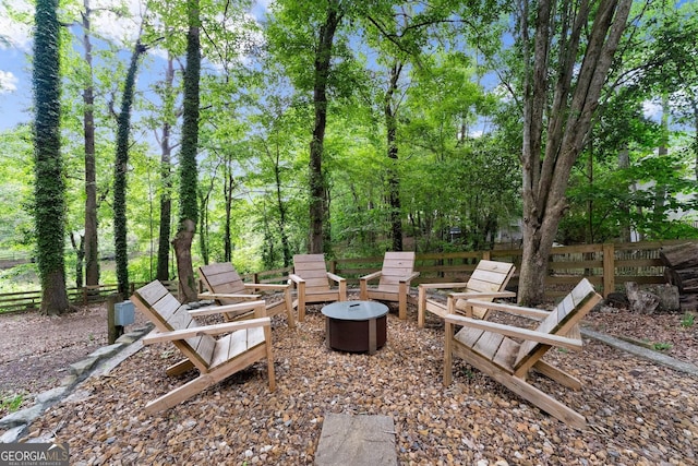 6520 Glen Pond Trce, Cumming, GA 30028 - view of yard featuring an outdoor fire pit and fence