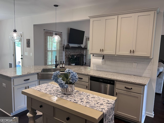 216 Springdale Estates Dr, Senoia, GA 30276 - kitchen featuring dishwasher, decorative backsplash, a peninsula, a sink, and a fireplace
