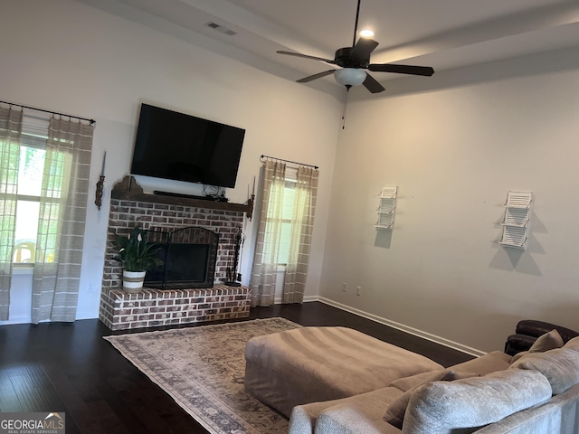216 Springdale Estates Dr, Senoia, GA 30276 - living area featuring wood finished floors, a ceiling fan, a brick fireplace, and baseboards